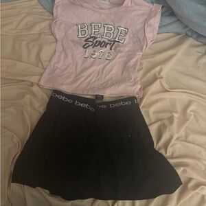 Bebe Pink Sport Tee and Black Skirt Ensemble